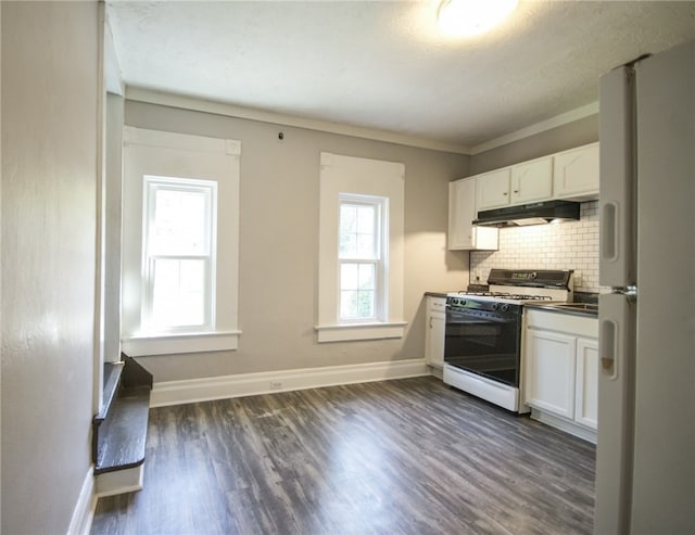 kitchen featuring white cabinets, white appliances, dark hardwood / wood-style flooring, crown molding, and backsplash