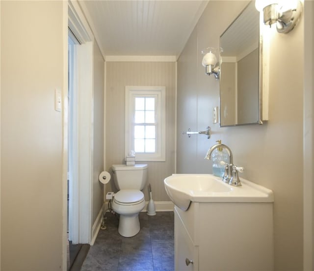 bathroom with ornamental molding, toilet, tile patterned flooring, and vanity