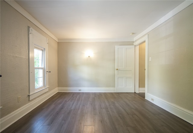 spare room featuring dark hardwood / wood-style floors