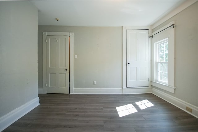 empty room featuring dark hardwood / wood-style floors