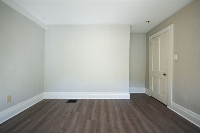 empty room featuring dark hardwood / wood-style floors