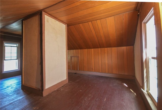 additional living space featuring dark hardwood / wood-style floors, wooden ceiling, and vaulted ceiling