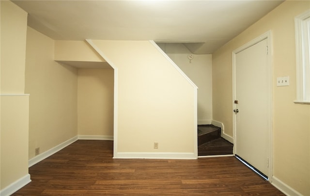 basement with dark wood-type flooring