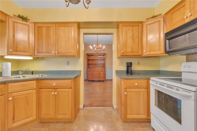 kitchen with light hardwood / wood-style floors, electric range, a chandelier, and sink