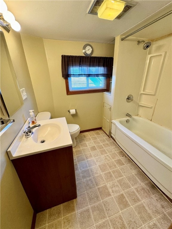 full bathroom featuring tub / shower combination, vanity, and toilet