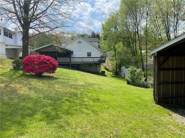 view of yard with a storage unit and a deck