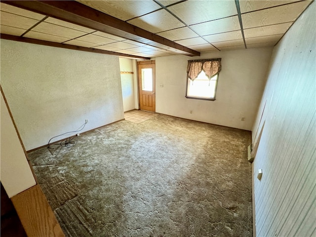 empty room featuring a drop ceiling