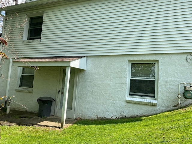 view of home's exterior featuring a lawn