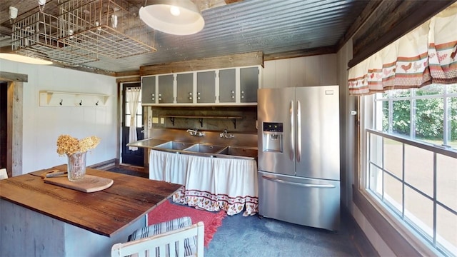 kitchen with stainless steel refrigerator with ice dispenser