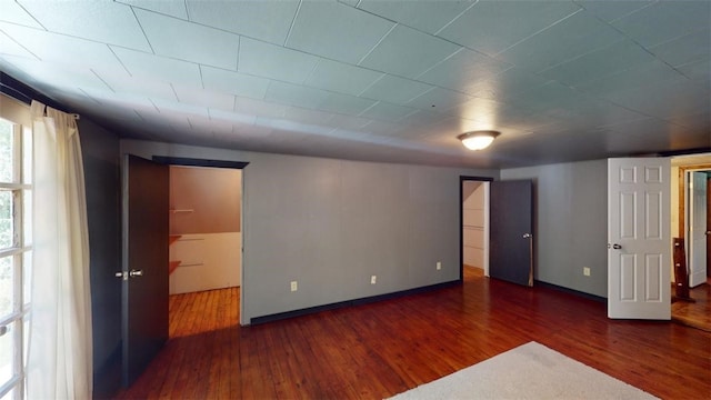 basement featuring dark hardwood / wood-style floors