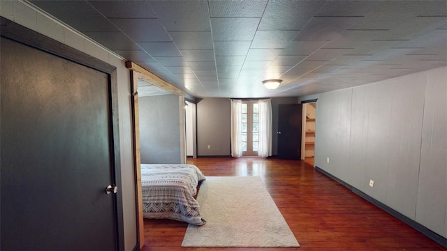 bedroom featuring dark hardwood / wood-style flooring