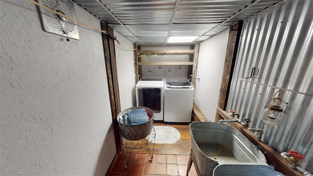 clothes washing area featuring washer and dryer