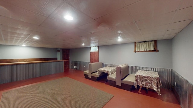 basement featuring a drop ceiling