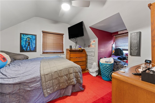 bedroom featuring lofted ceiling, carpet, and ceiling fan