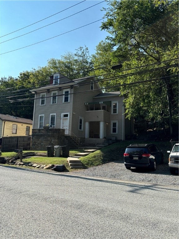 view of front of property featuring a balcony