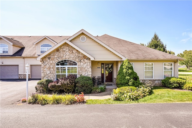 single story home with a garage