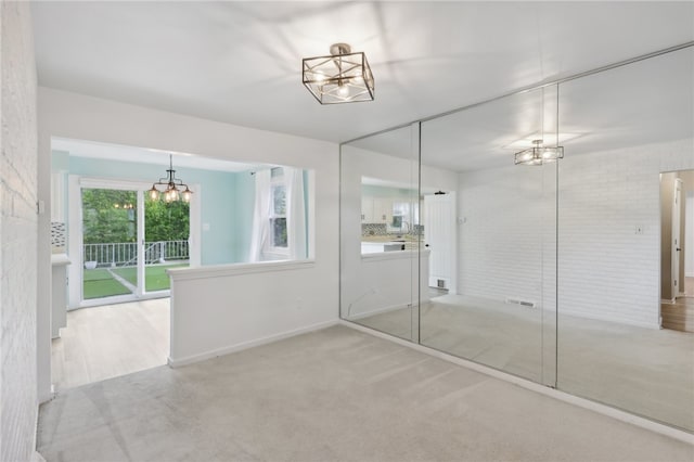 bathroom with a chandelier