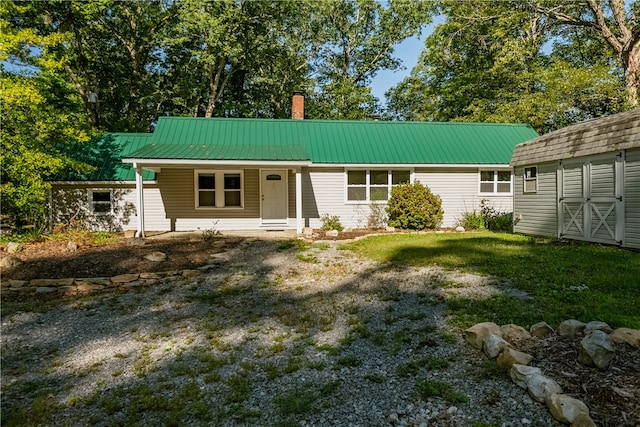 rear view of house with a yard