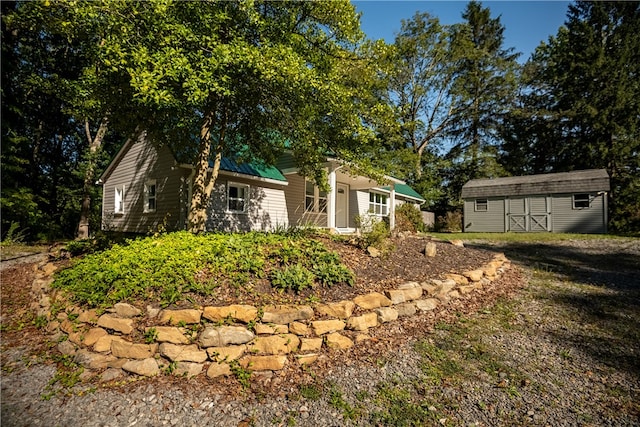 view of front facade with a shed