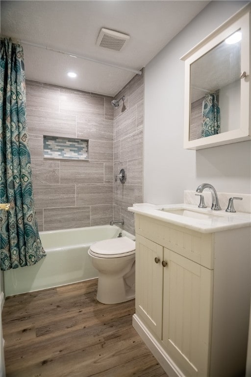 full bathroom featuring vanity, toilet, shower / tub combo, and wood-type flooring