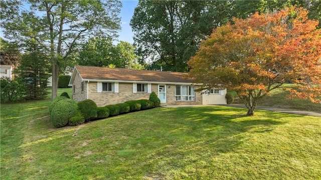 ranch-style house with a front lawn