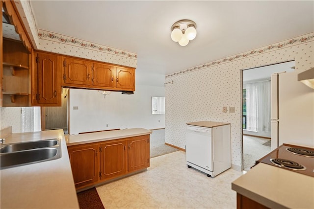 kitchen with sink and white appliances