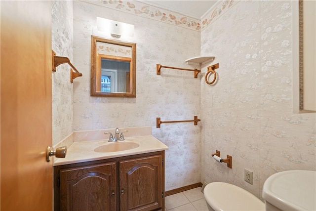 bathroom featuring tile patterned flooring, vanity, and toilet