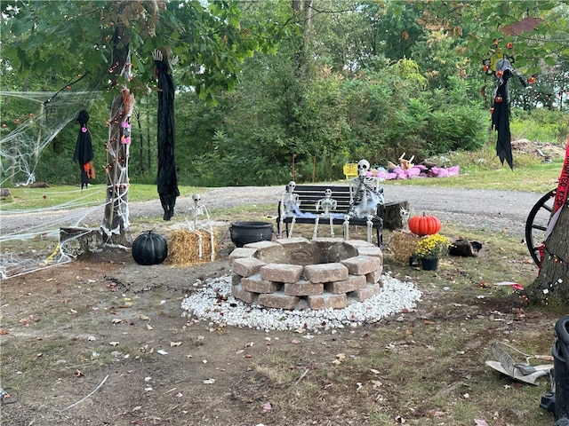 view of yard with a fire pit