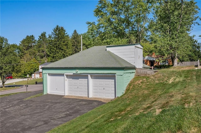 garage featuring a yard