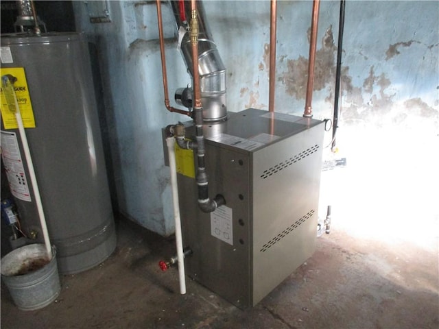 utility room featuring gas water heater