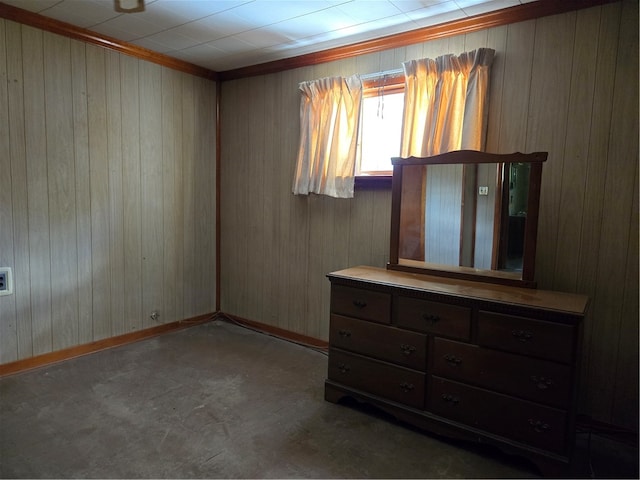 bedroom with concrete floors and wooden walls