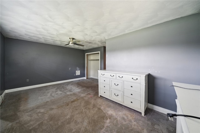 unfurnished bedroom featuring dark carpet