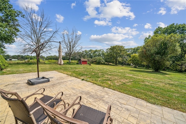 view of patio / terrace with a shed