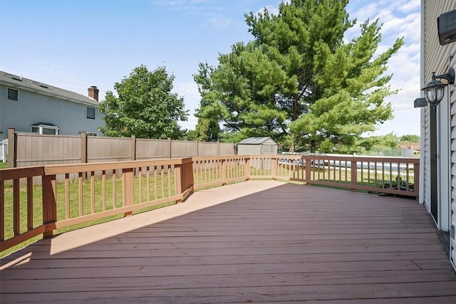 deck with a yard and a storage unit