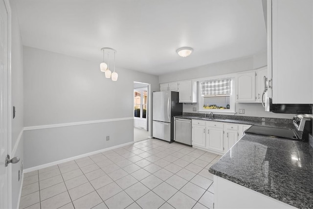 kitchen featuring light tile patterned floors, white cabinetry, sink, and stainless steel appliances