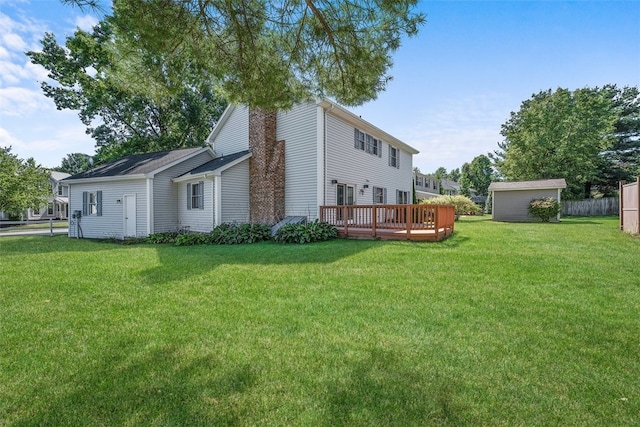 view of side of home with a yard, a storage unit, and a deck