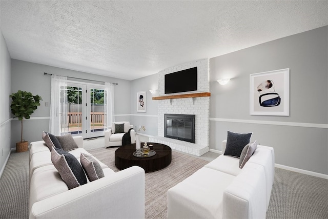 carpeted living room with a brick fireplace and a textured ceiling