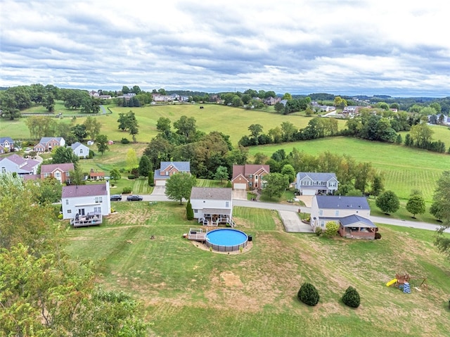 birds eye view of property with a rural view