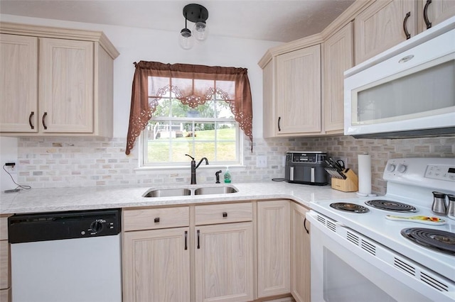 kitchen featuring decorative backsplash, light brown cabinets, white appliances, and sink