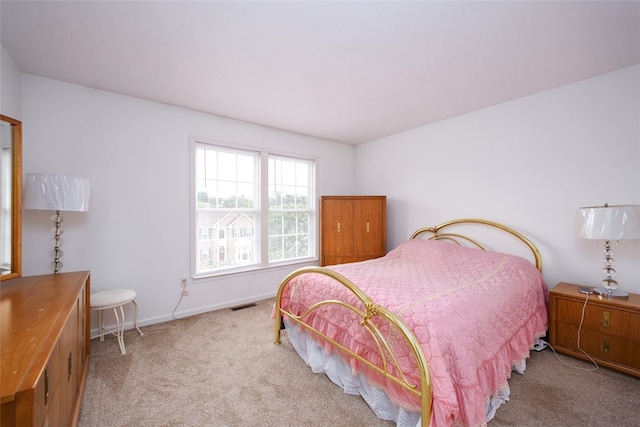 bedroom with light carpet