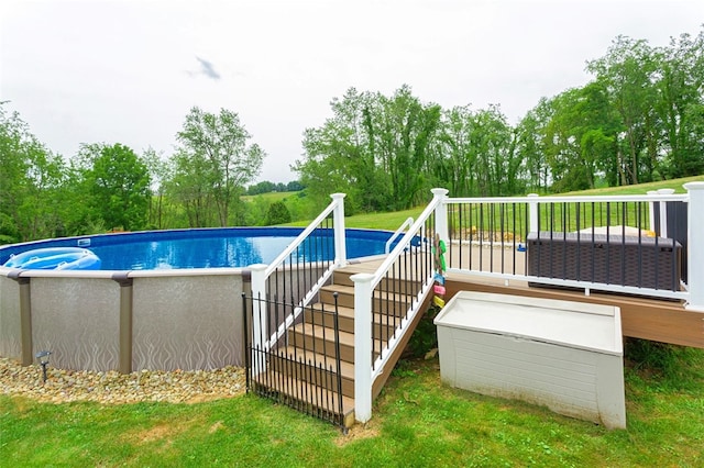 view of pool featuring a wooden deck