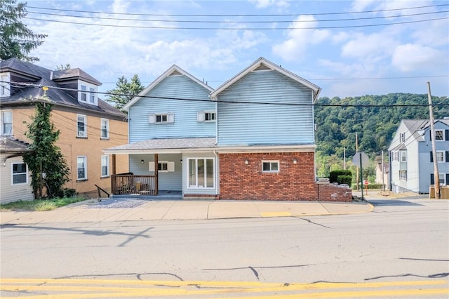 4900 Walnut St, Versailles Boro, PA 15132 - view of front of home with brick siding and covered porch