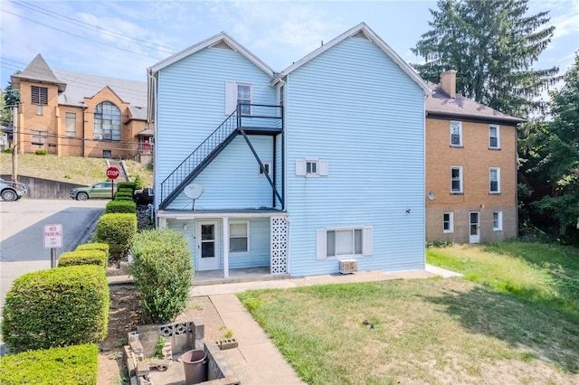 4900 Walnut St, Versailles Boro, PA 15132 - rear view of property with a lawn