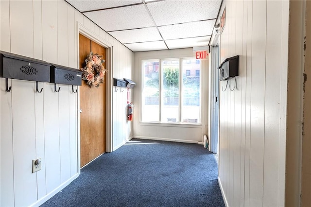 4900 Walnut St, Versailles Boro, PA 15132 - mudroom with dark carpet, a paneled ceiling, baseboards, and wooden walls