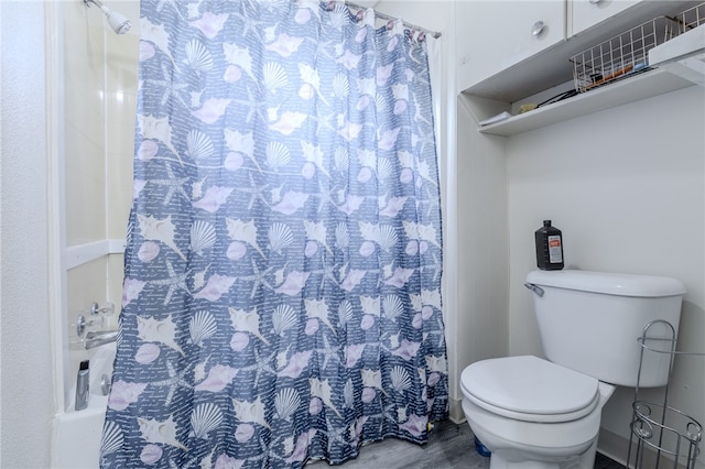 bathroom with hardwood / wood-style flooring, toilet, and a shower with shower curtain