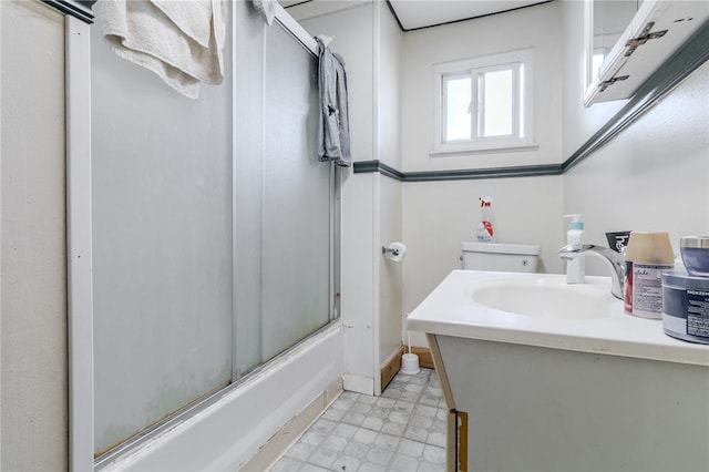 full bathroom featuring shower / bath combination with glass door, vanity, and toilet