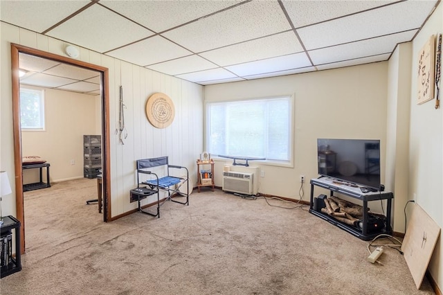 4900 Walnut St, Versailles Boro, PA 15132 - sitting room with carpet floors, baseboards, a paneled ceiling, and a wall mounted air conditioner