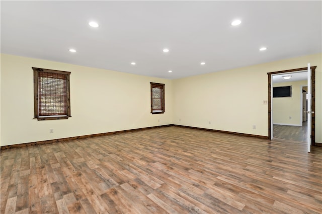 unfurnished room featuring wood-type flooring