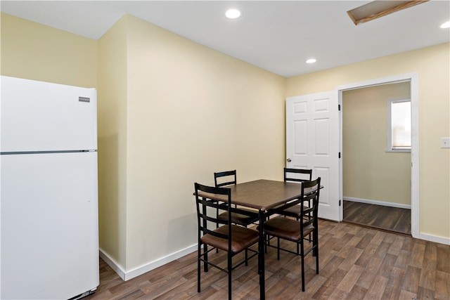 dining space featuring dark hardwood / wood-style floors