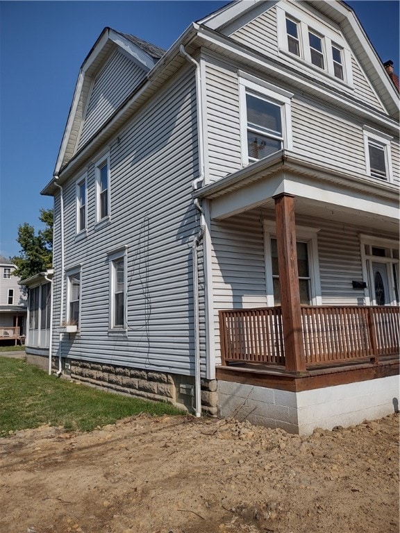 view of home's exterior with a porch